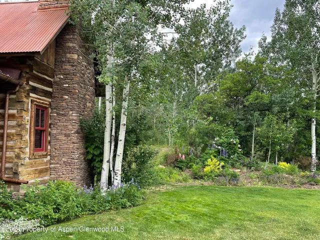 a backyard of a house with lots of green space