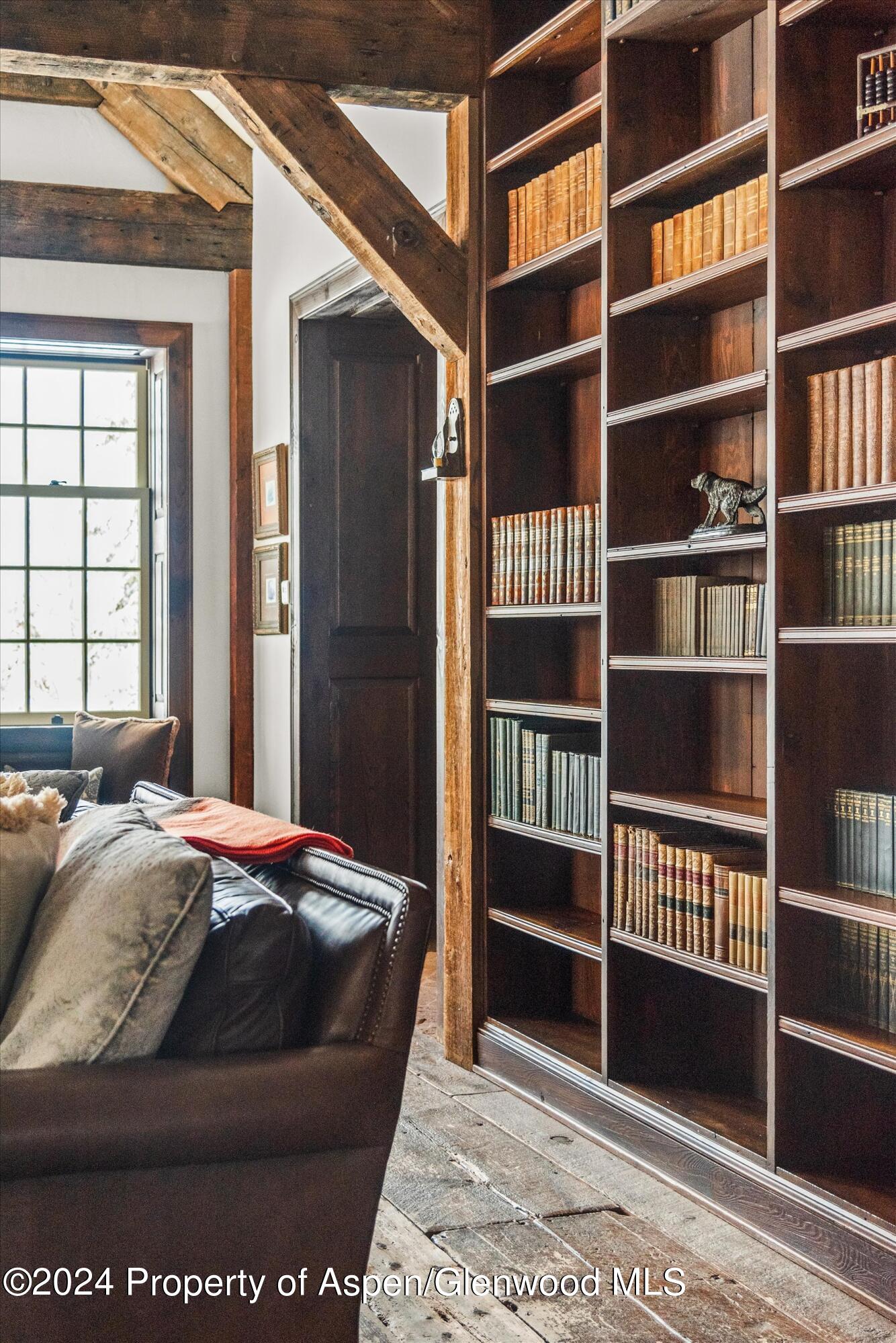 855 Moore Drive Aspen, CO 81611 - Photo 6 of 50 a bed sitting in a bedroom next to a window