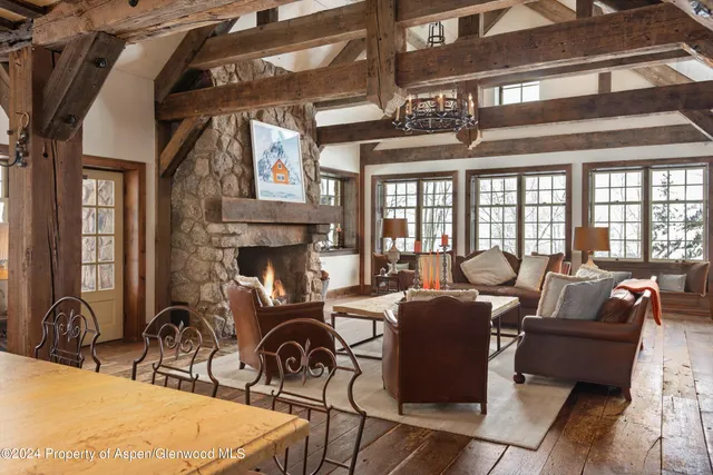 a living room with fireplace furniture and a fireplace