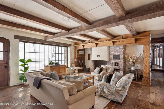 a living room with furniture and fireplace