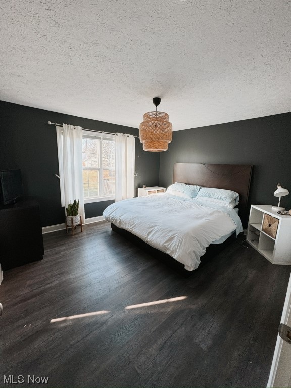 3249 Rausch Avenue Ravenna, OH 44266 - Photo 14 of 35 Bedroom featuring dark wood-type flooring and a textured ceiling