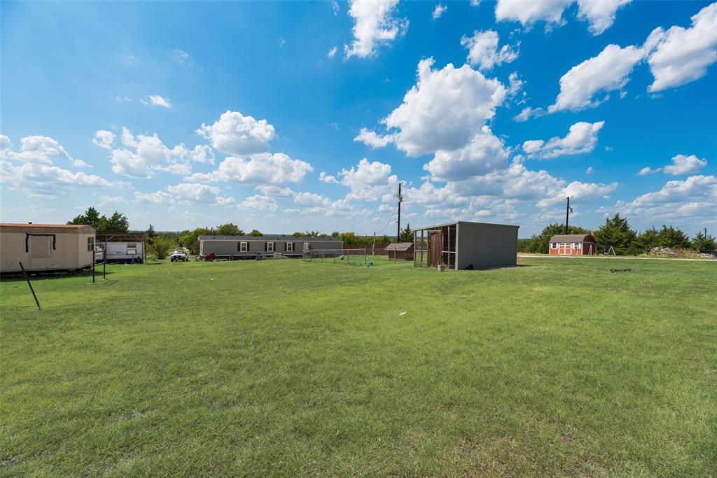 958 Watkins Road Sherman, TX 75090 - Photo 3 of 23 Expansive grassy terrain with multiple residential structures and outbuildings