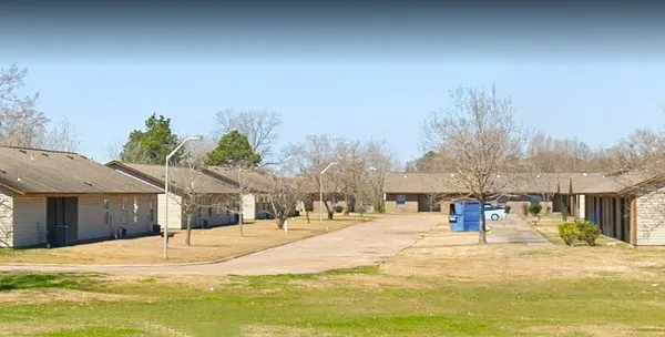 a house with trees in the background