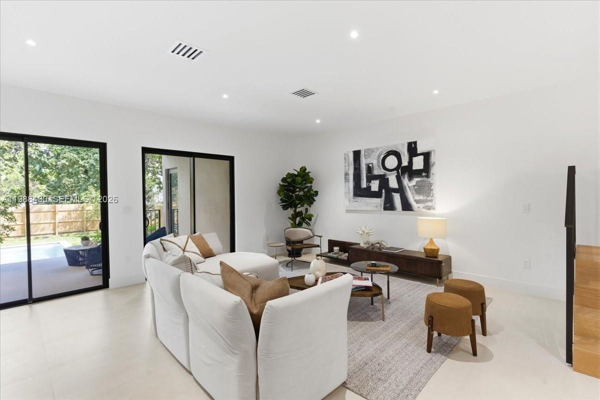 2925 Southwest 36th Avenue Miami, FL 33133 - Photo 11 of 59 a living room with furniture and a large window