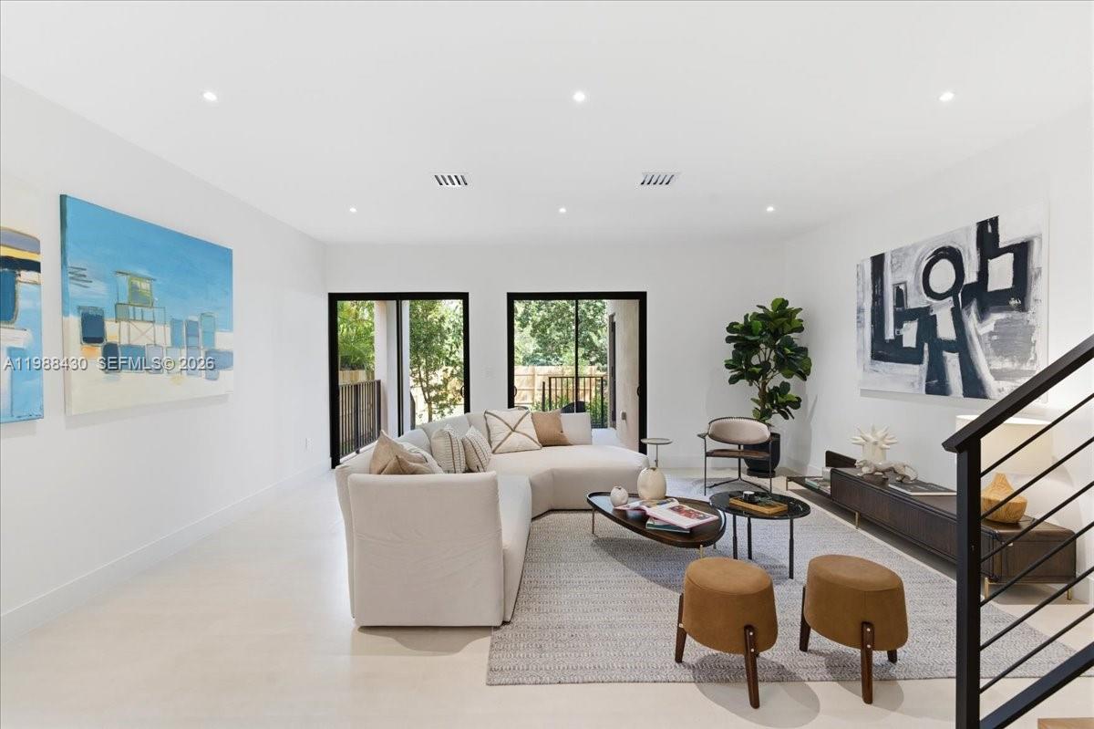 2925 Southwest 36th Avenue Miami, FL 33133 - Photo 12 of 59 a living room with furniture and a large window