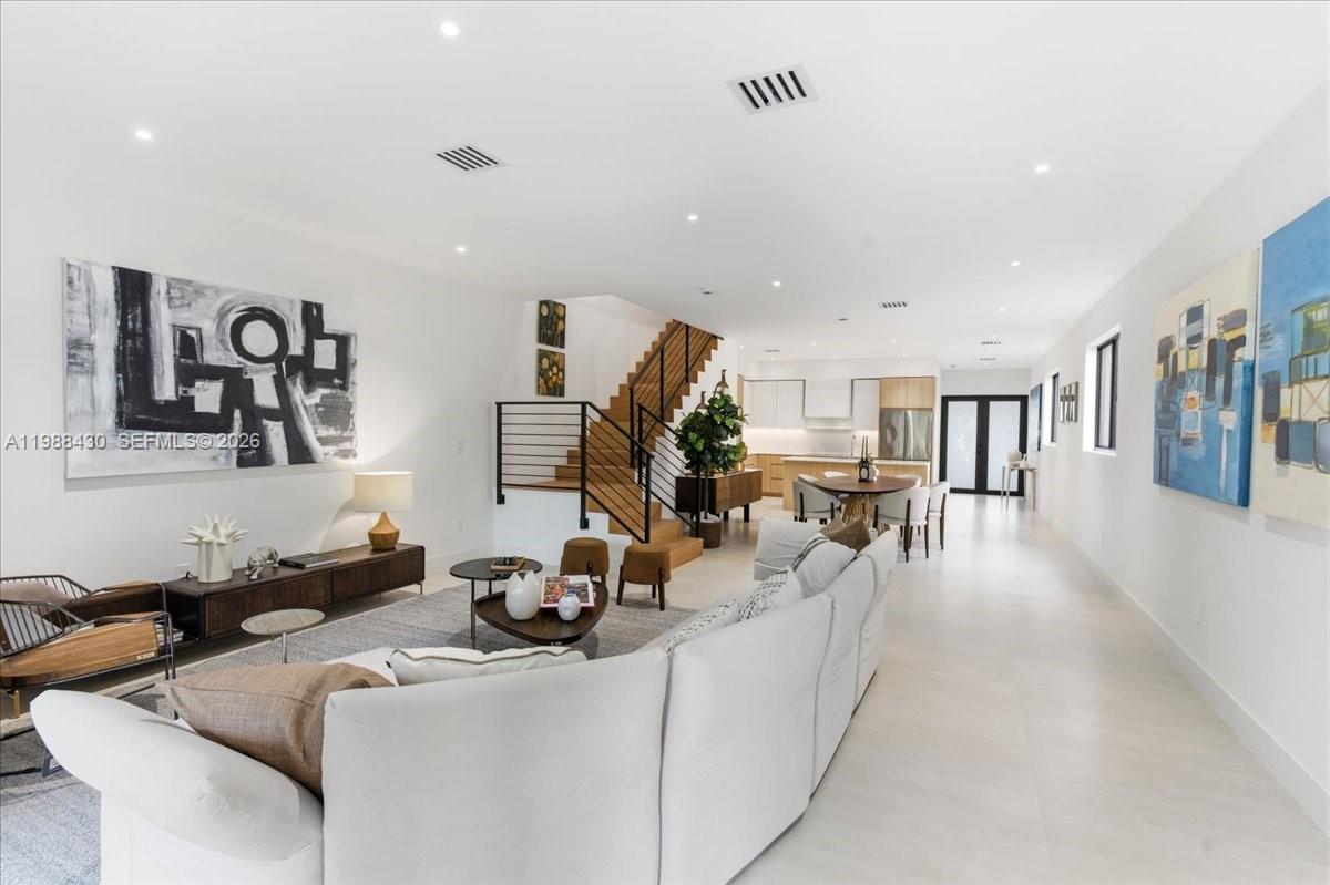 2925 Southwest 36th Avenue Miami, FL 33133 - Photo 16 of 59 a living room with furniture and a flat screen tv