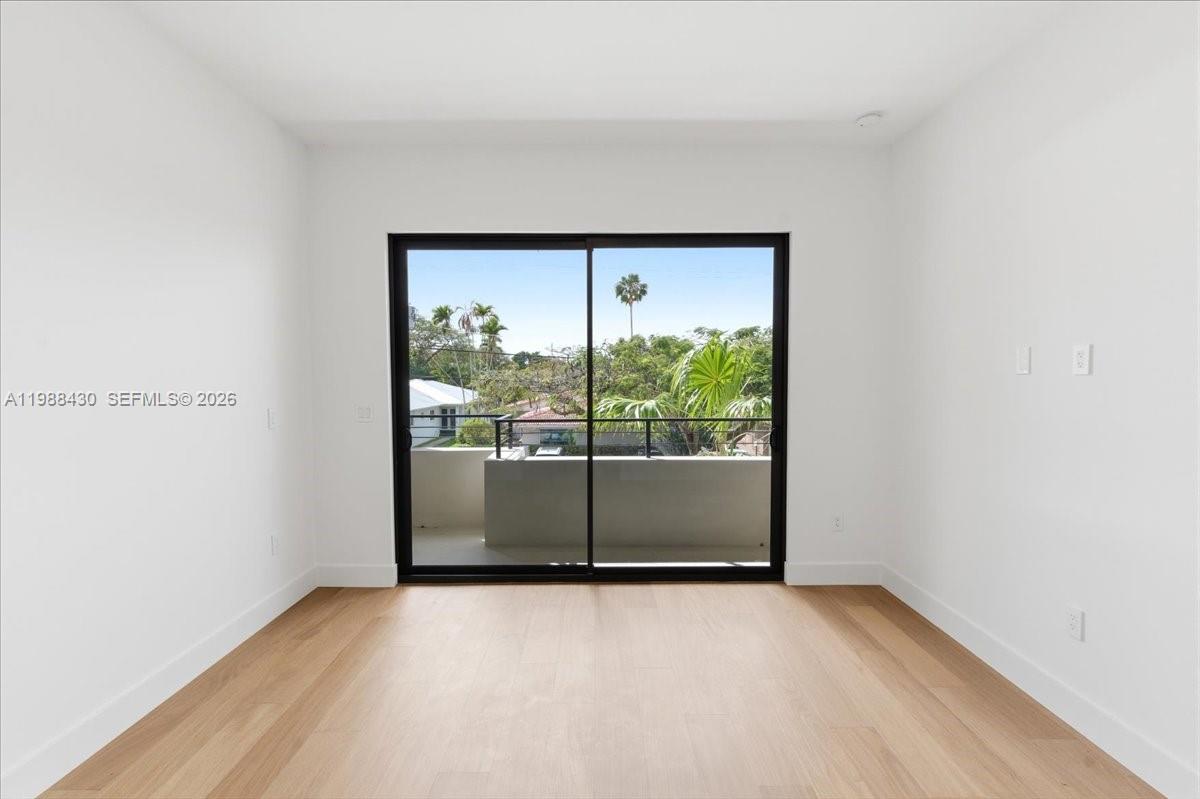 2925 Southwest 36th Avenue Miami, FL 33133 - Photo 20 of 59 a view of a room with sliding glass door