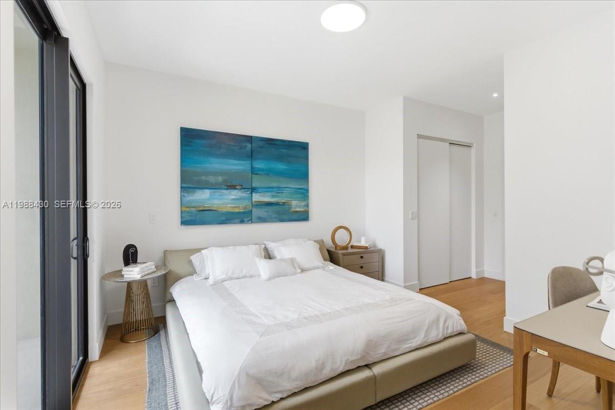 2925 Southwest 36th Avenue Miami, FL 33133 - Photo 42 of 59 a bedroom with a bed and a window