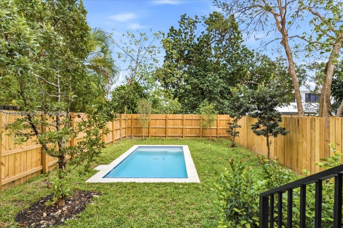 2925 Southwest 36th Avenue Miami, FL 33133 - Photo 52 of 59 a view of a backyard with large trees