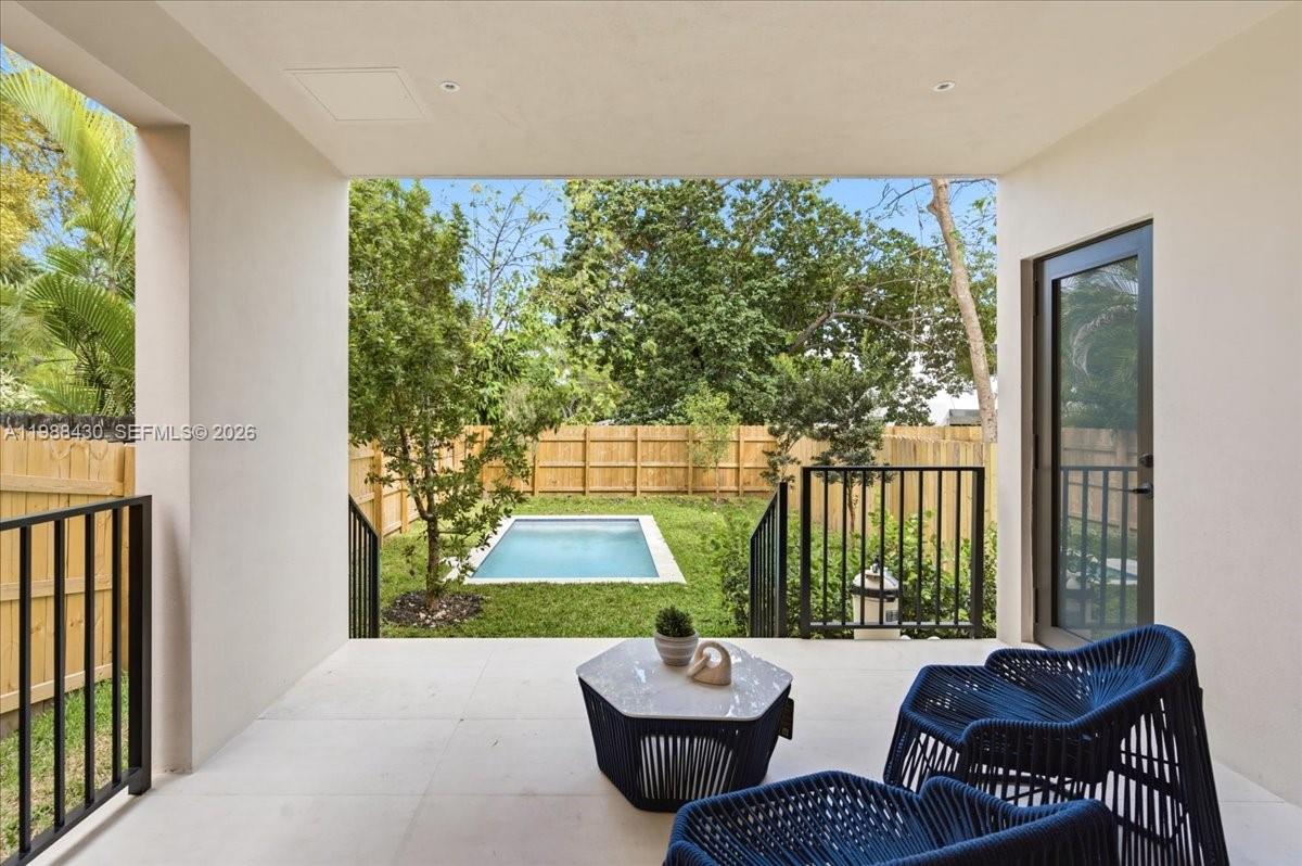 2925 Southwest 36th Avenue Miami, FL 33133 - Photo 54 of 59 a living room with patio furniture and a potted plant