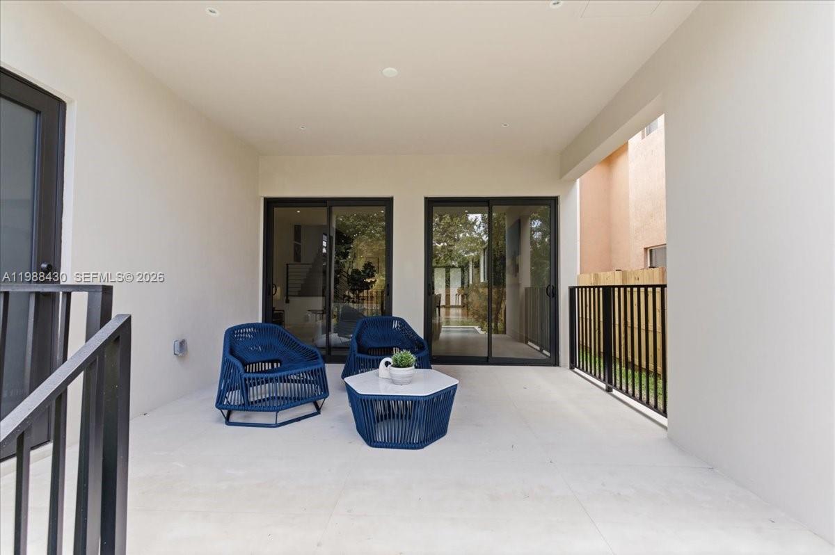 2925 Southwest 36th Avenue Miami, FL 33133 - Photo 56 of 59 a living room with furniture a window and a potted plant
