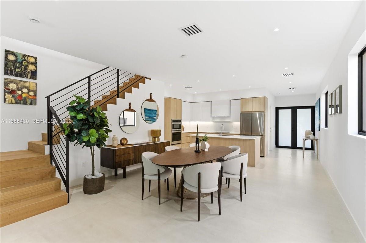 2925 Southwest 36th Avenue Miami, FL 33133 - Photo 10 of 59 a dining room with furniture and window