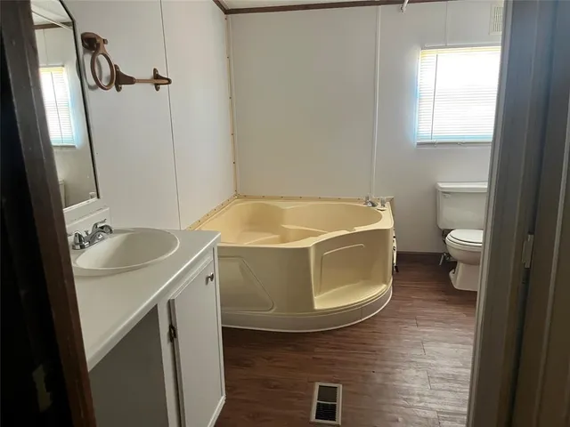 a view of front door with wooden floor