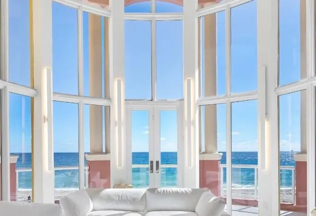 a view of a livingroom with furniture and windows