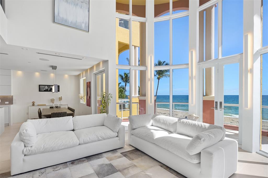 2140 North Ocean Boulevard, Unit V Fort Lauderdale, FL 33305 - Photo 21 of 63 a living room with furniture and a large window