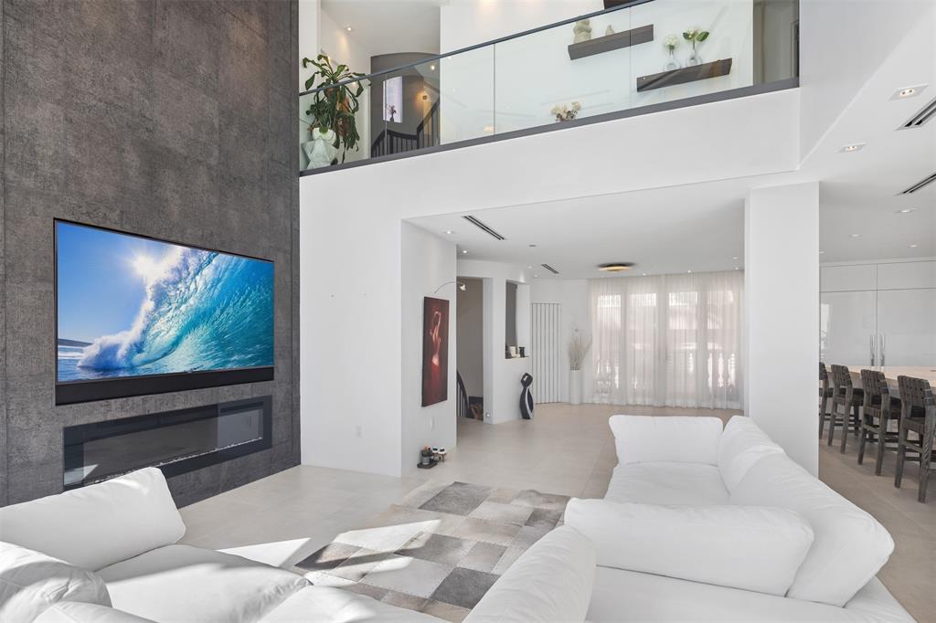 2140 North Ocean Boulevard, Unit V Fort Lauderdale, FL 33305 - Photo 24 of 63 a living room with furniture and a flat screen tv