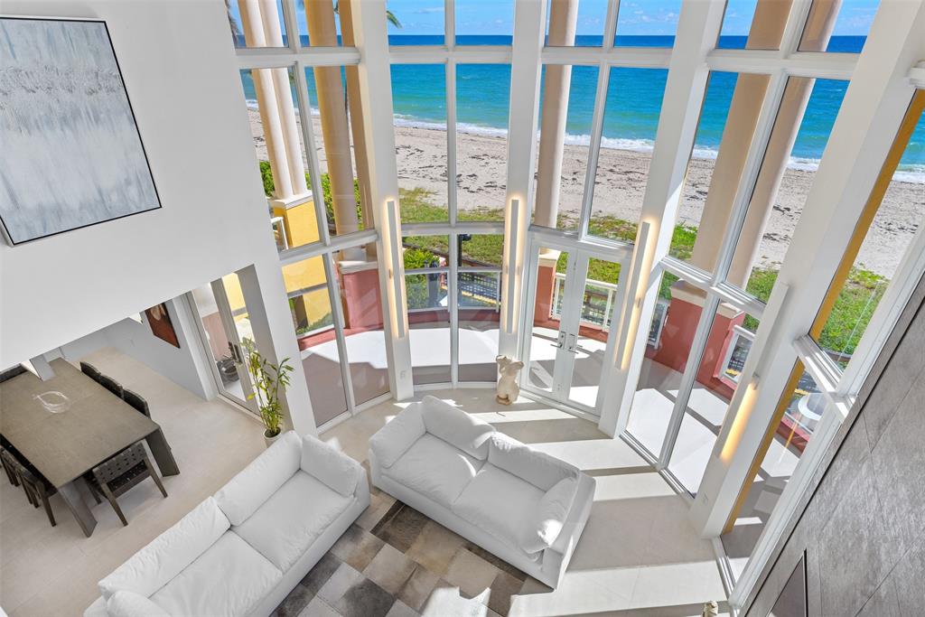 2140 North Ocean Boulevard, Unit V Fort Lauderdale, FL 33305 - Photo 32 of 63 a living room with large furniture and a large window