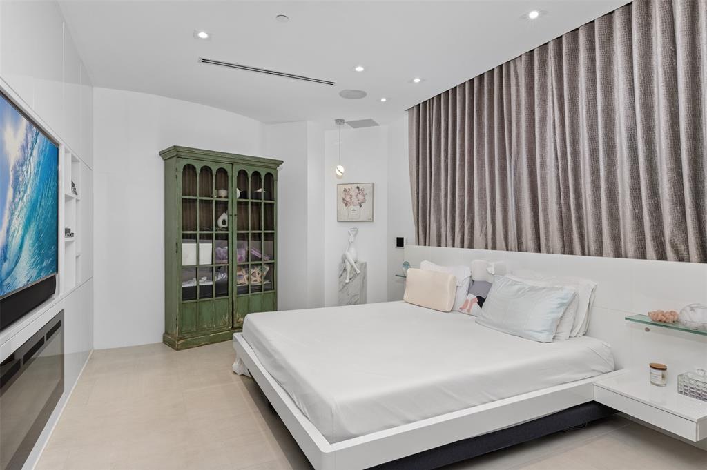 2140 North Ocean Boulevard, Unit V Fort Lauderdale, FL 33305 - Photo 33 of 63 a bedroom with a bed and a window