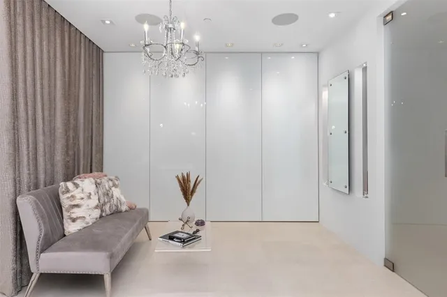 a living room with furniture and a lamp