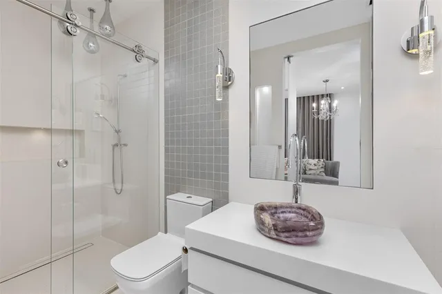 a view of a room with furniture and window