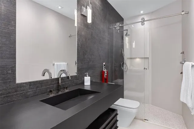 a bathroom with a bathtub and a shower