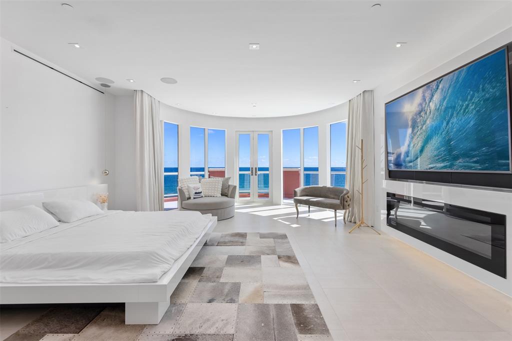 2140 North Ocean Boulevard, Unit V Fort Lauderdale, FL 33305 - Photo 40 of 63 a living room with furniture and a flat screen tv