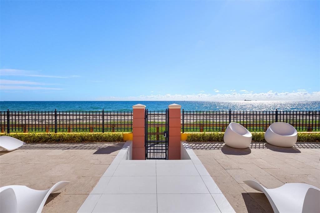2140 North Ocean Boulevard, Unit V Fort Lauderdale, FL 33305 - Photo 4 of 63 a swimming pool with potted plants and big yard