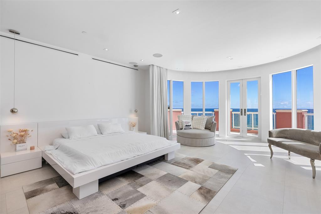 2140 North Ocean Boulevard, Unit V Fort Lauderdale, FL 33305 - Photo 41 of 63 a living room with furniture and a large window