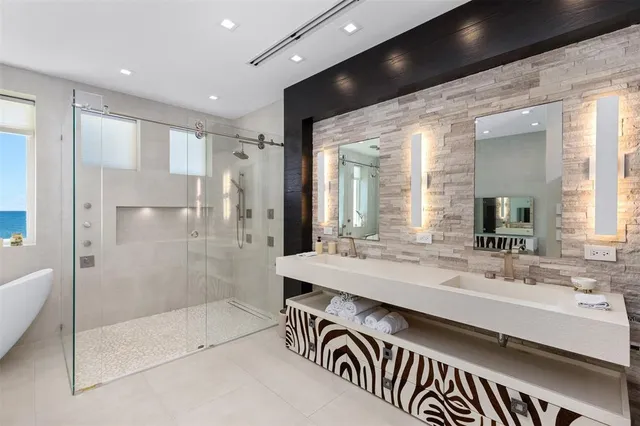 a view of a patio with couches table and chairs and potted plants