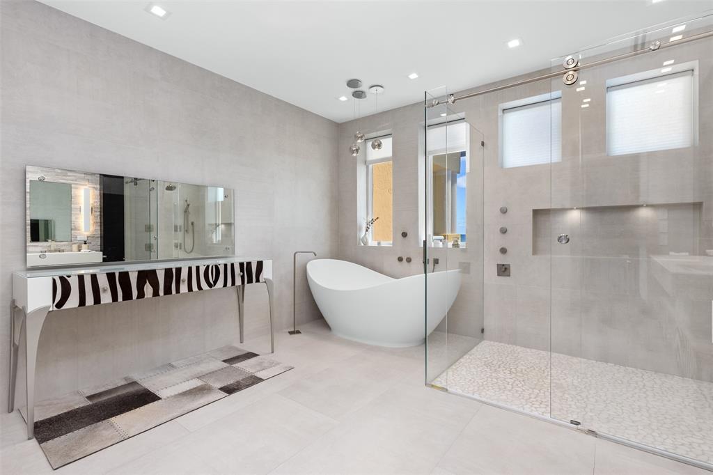 2140 North Ocean Boulevard, Unit V Fort Lauderdale, FL 33305 - Photo 47 of 63 a bathroom with a bathtub and a shower