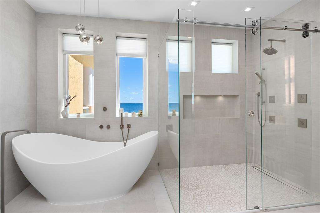 2140 North Ocean Boulevard, Unit V Fort Lauderdale, FL 33305 - Photo 48 of 63 a bathroom with a bathtub and shower