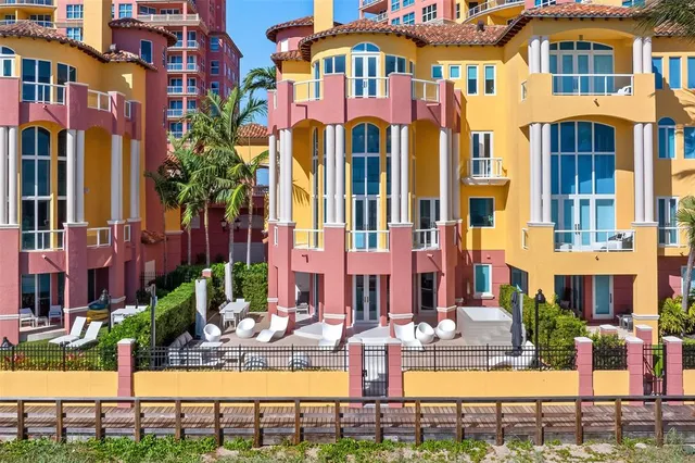 a front view of a residential apartment building with a yard