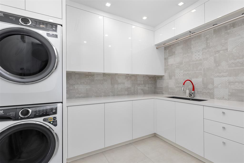 2140 North Ocean Boulevard, Unit V Fort Lauderdale, FL 33305 - Photo 62 of 63 a utility room with sink dryer and washer