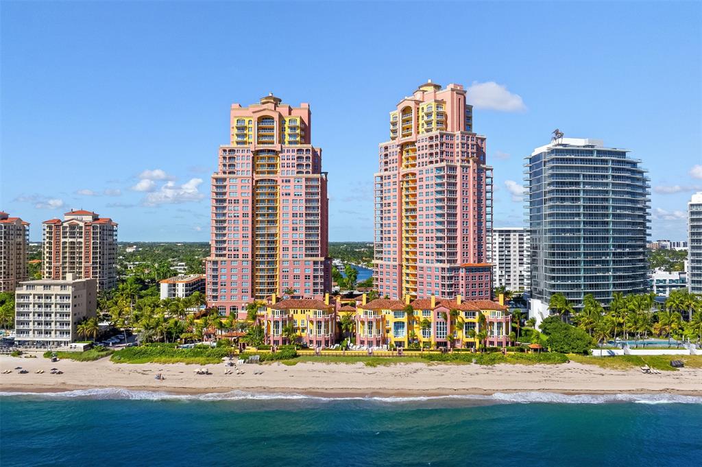 2140 North Ocean Boulevard, Unit V Fort Lauderdale, FL 33305 - Photo 7 of 63 a front view of a residential apartment building with a yard