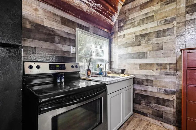 a kitchen with a stove and a sink