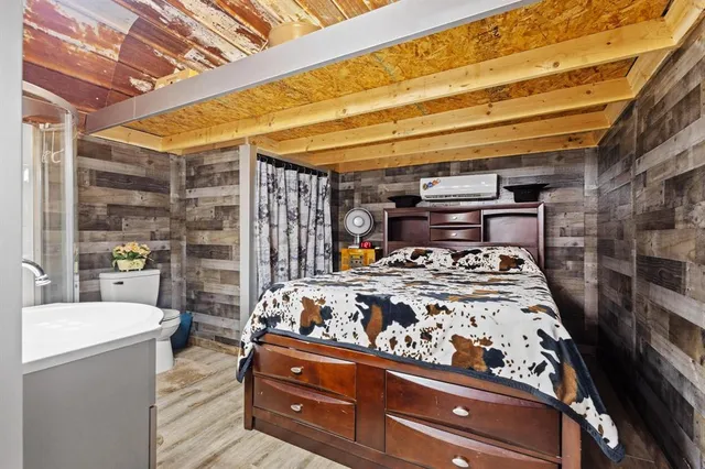 a bed room with a bed and a chair