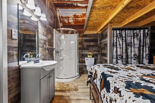 a bed room with a bed and a table