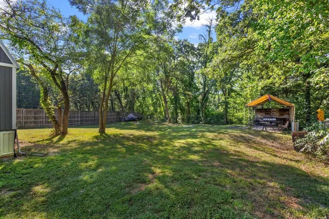 a view of a house with swimming pool and sitting area