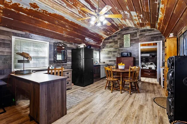 a kitchen with lots of counter top space and stainless steel appliances