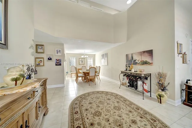 a kitchen with white cabinets and appliances