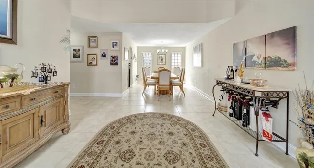 a living room with furniture and white walls