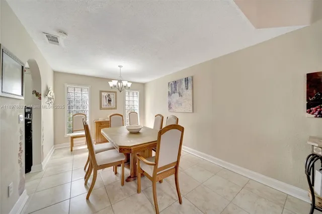 a kitchen with white cabinets stainless steel appliances and sink