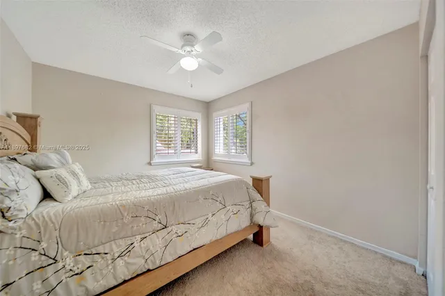a view of a livingroom with furniture and stairs