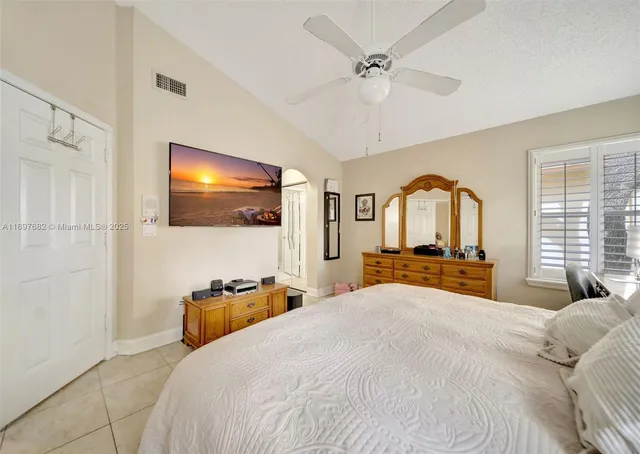 an aerial view of a house with garden space and street view