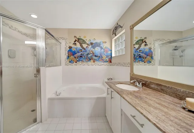 an aerial view of residential houses with outdoor space and parking