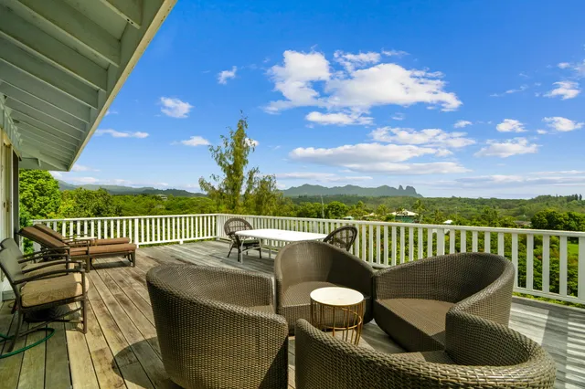 a view of a roof deck with couches chairs