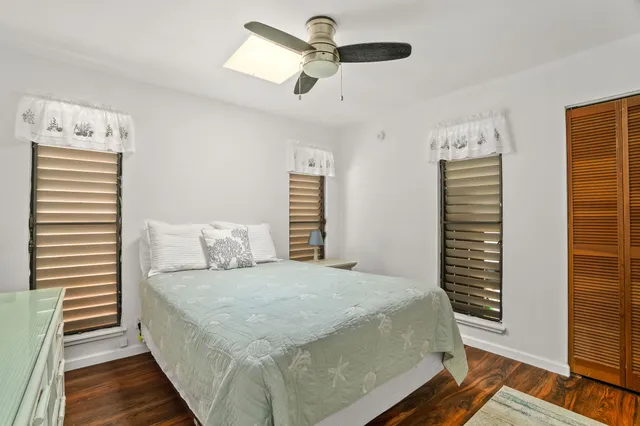 a bedroom with a bed and a walk in closet