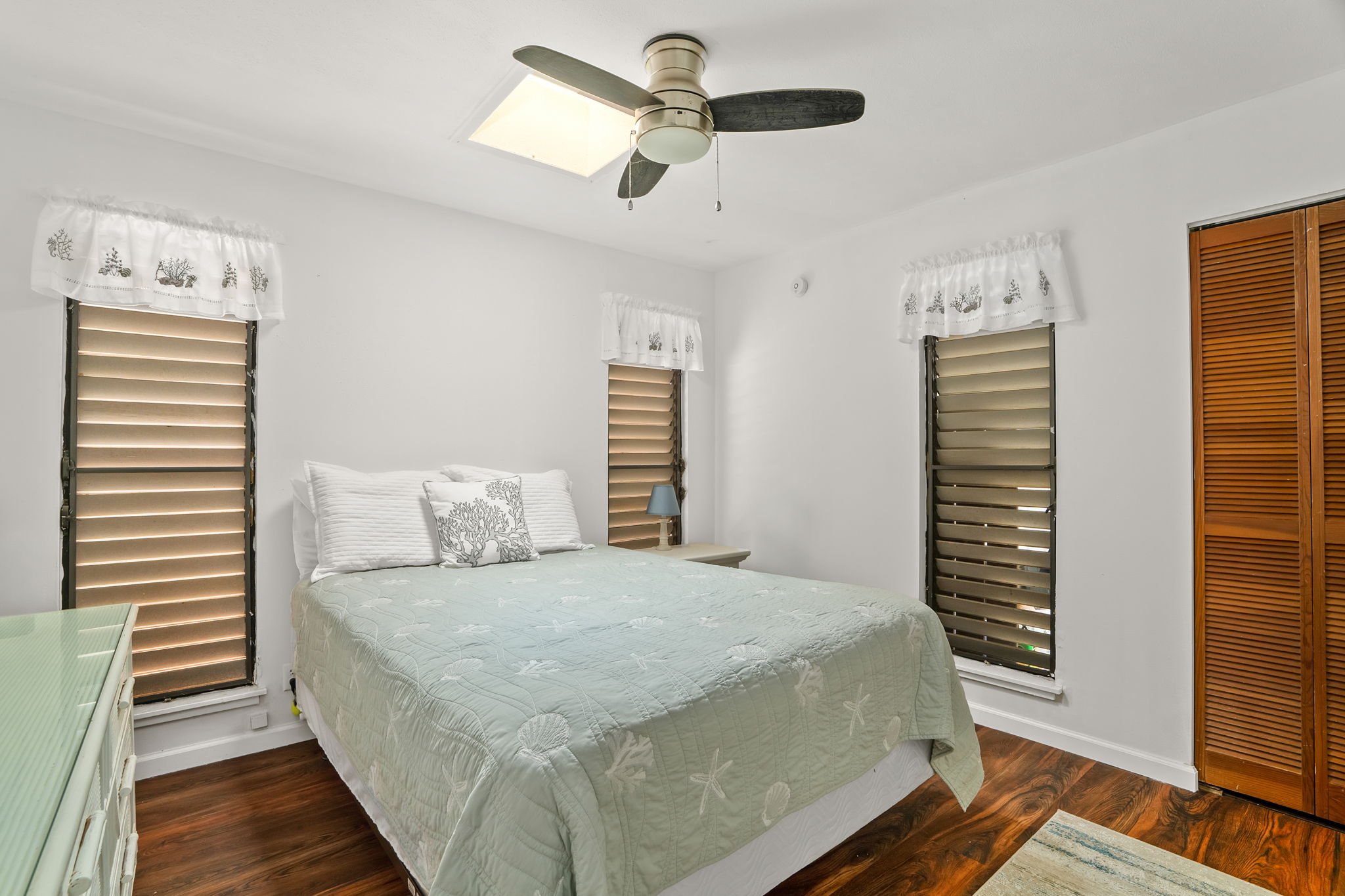 5366 Kumole Street Kapaa, HI 96746 - Photo 12 of 30 a bedroom with a bed and a walk in closet