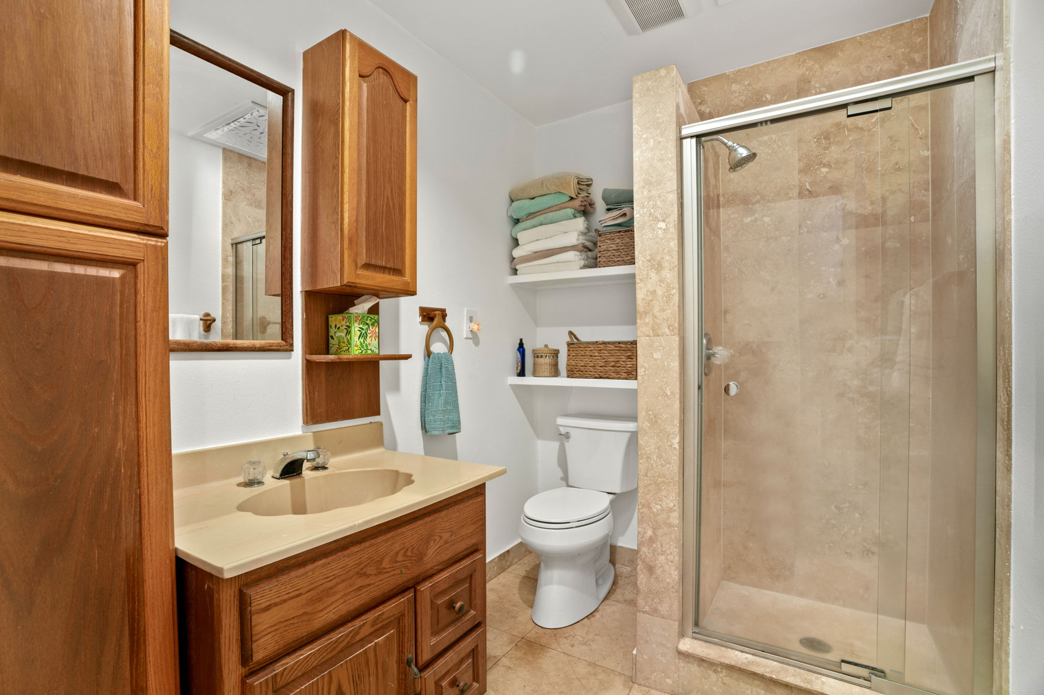 5366 Kumole Street Kapaa, HI 96746 - Photo 13 of 30 a bathroom with a sink toilet a mirror and shower