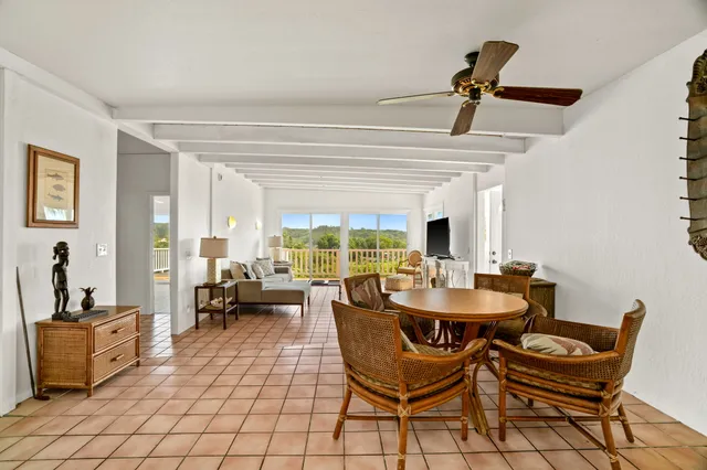a view of a livingroom with furniture window and outside view